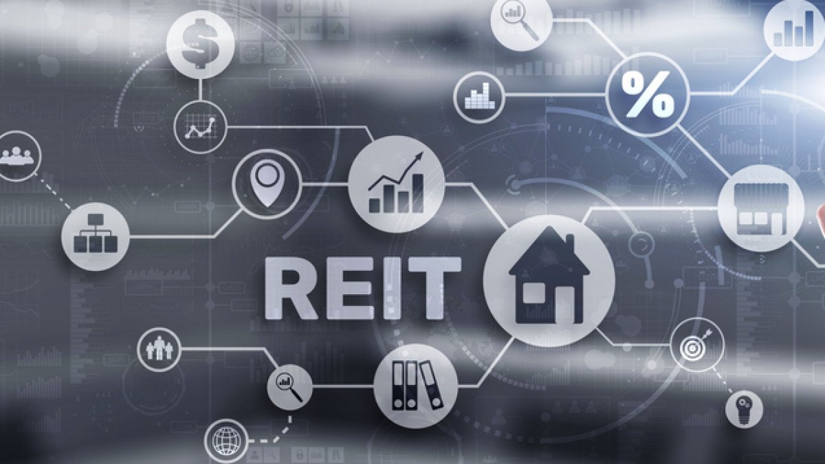 What is REIT, and how is it different from Real Estate Syndication
